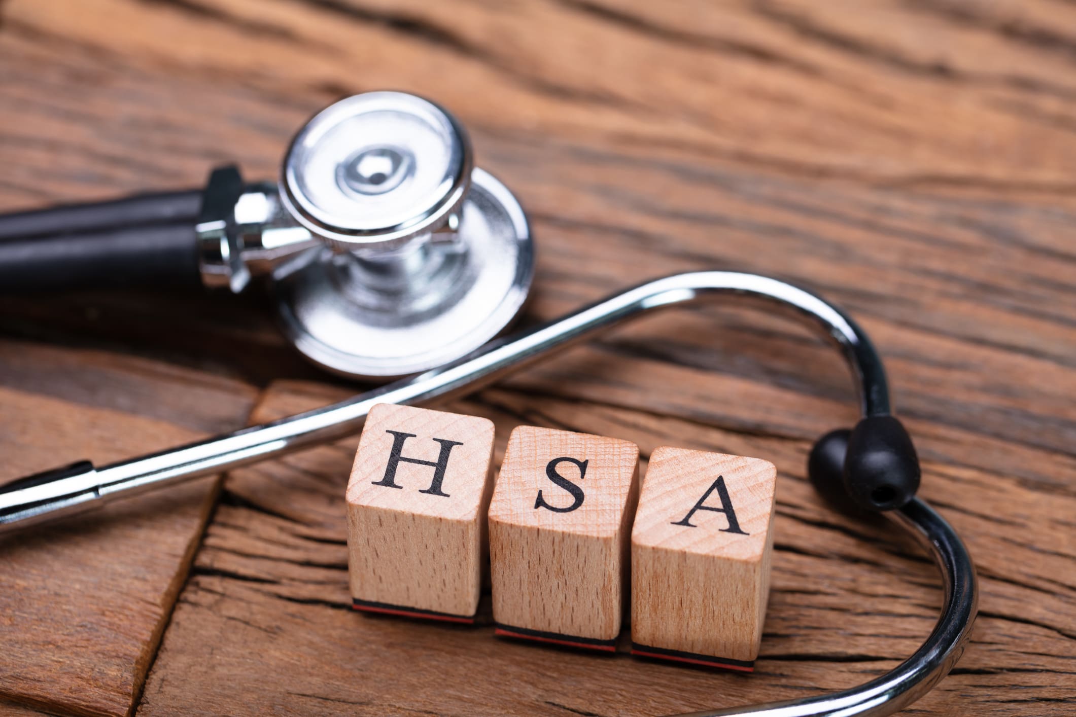 HSA Health Savings Account Wooden Blocks Near Stethoscope On Wooden Table